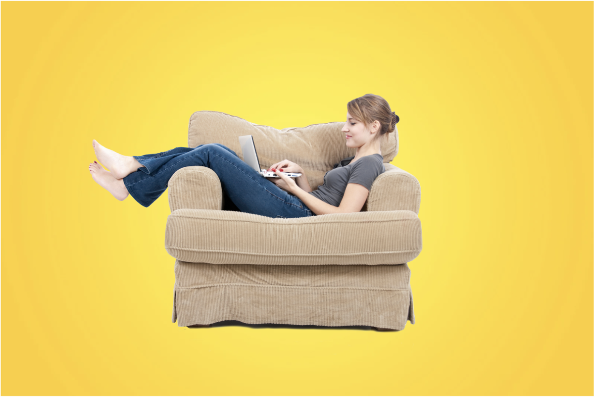 woman on a couch with a laptop woman on a couch with a laptop