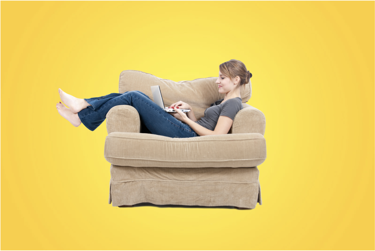 woman on a couch with a laptop